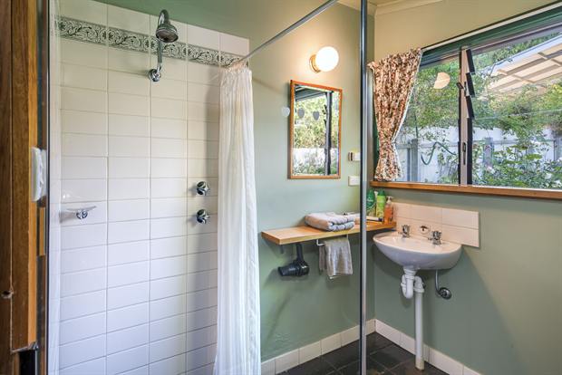 Cottage 10 — the cottage bathroom with shower, basin and heated floor
