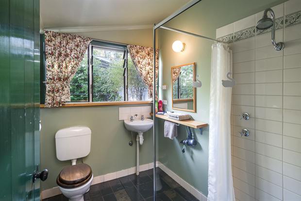 Cottage 8 — the cottage bathroom with shower, basin and heated floor
